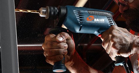 BALUX impact drill drilling into metal