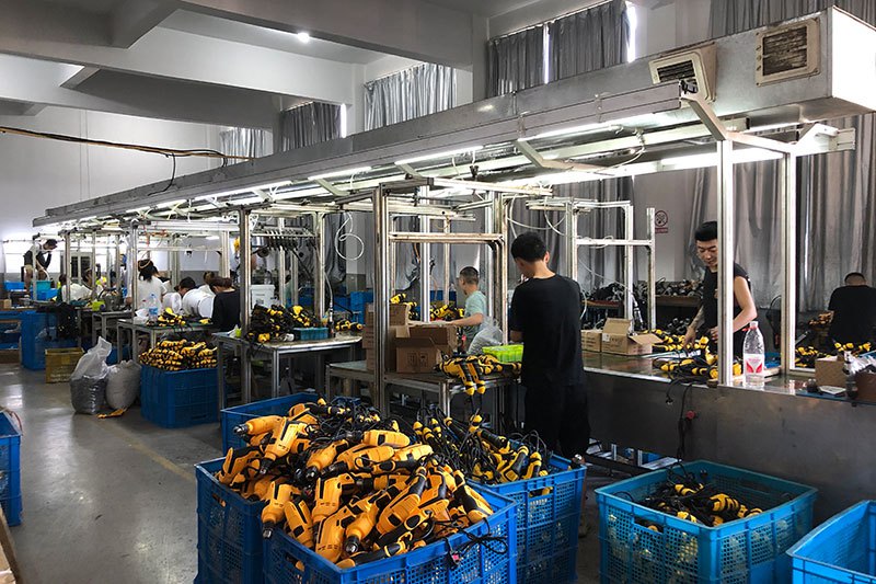 BALUX power tool assembly line with finished tools in crates
